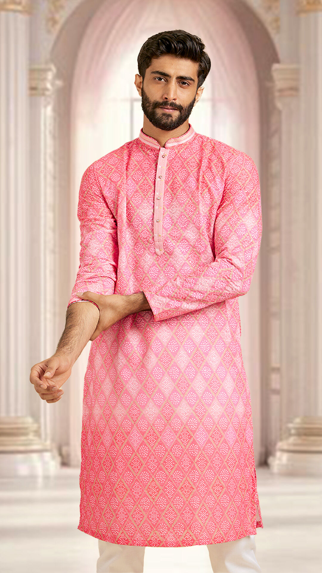 A man wearing beautifull printed pink kurta pajama 